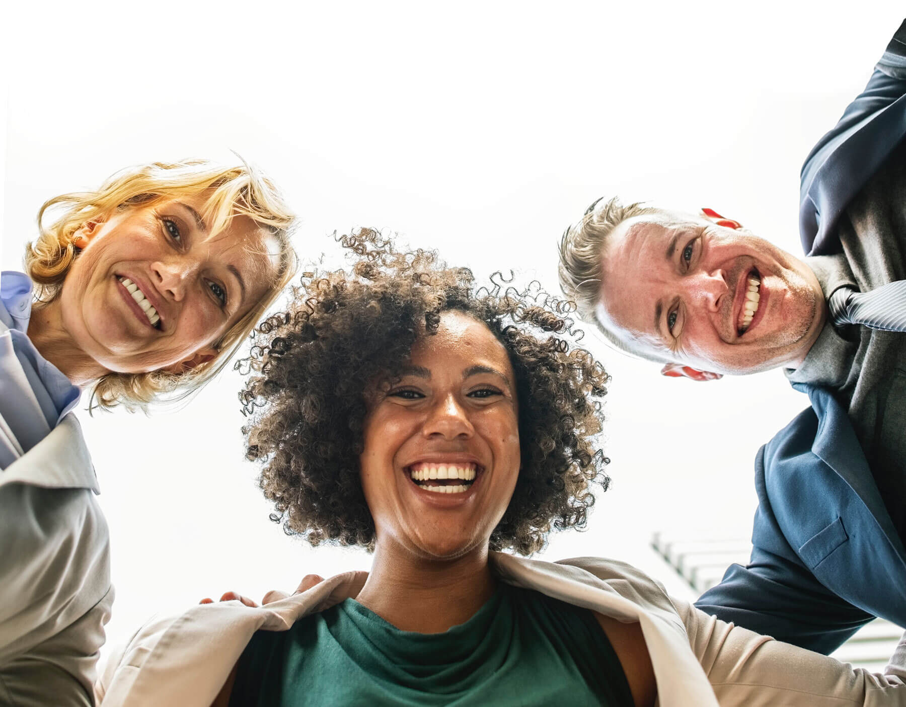 Three people smiling